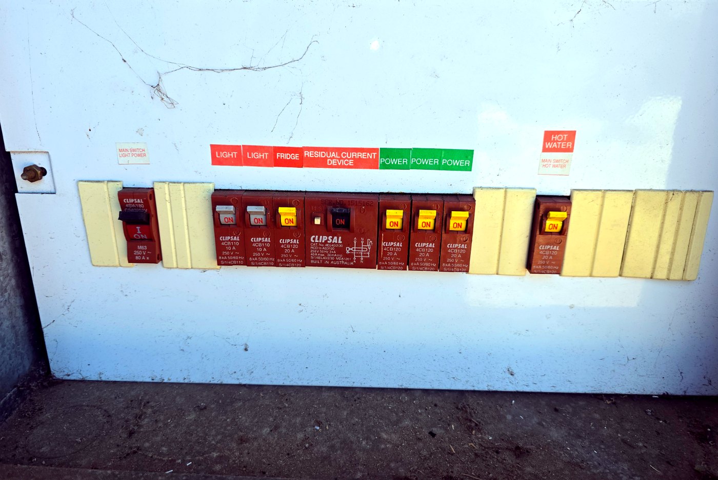 Older switchboard with old-style circuit breakers before upgrade